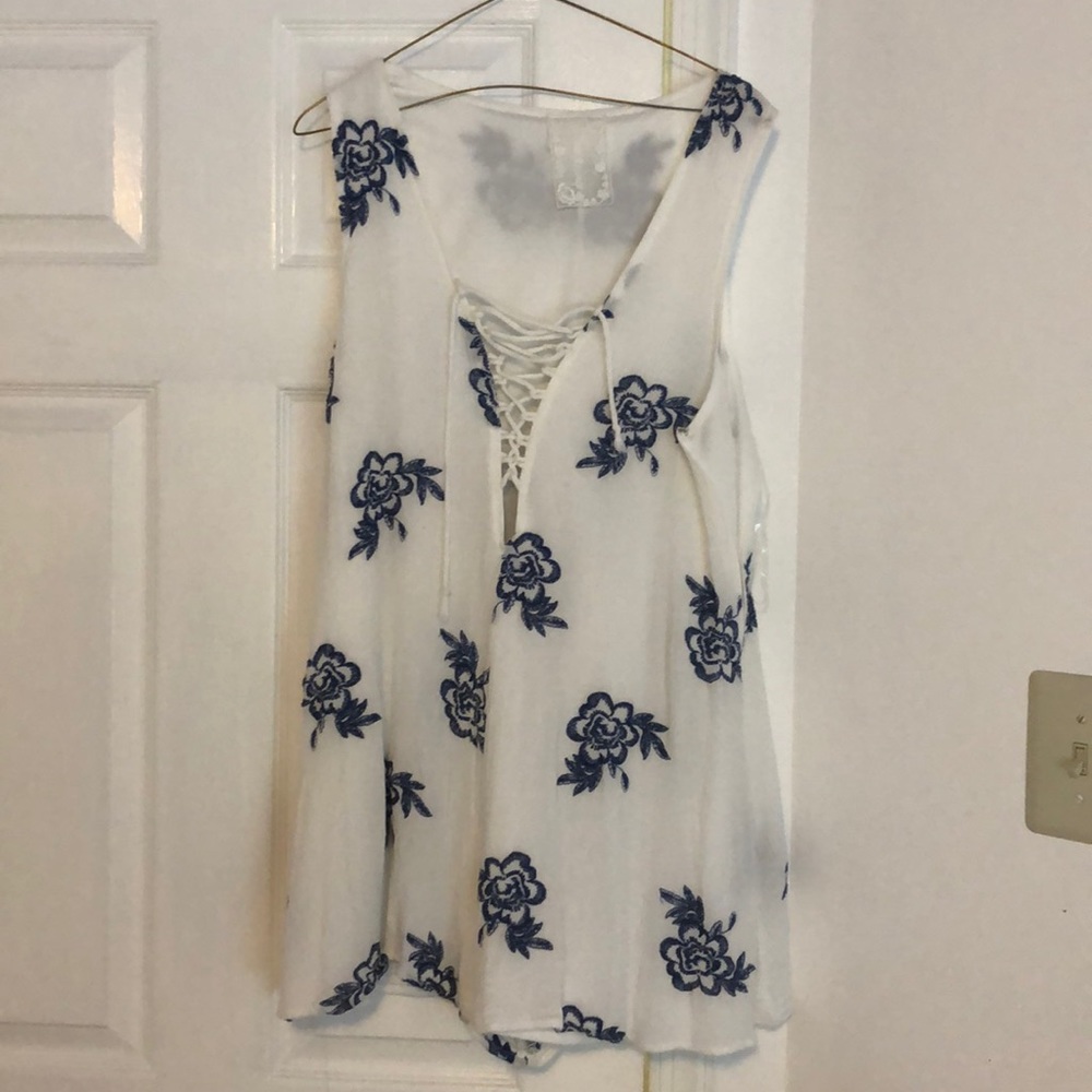 Sadie and Sage romper with blue flowers.